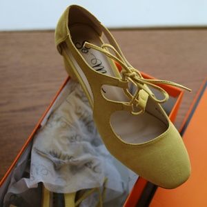 Mustard colored, faux suede lace-up heel.
